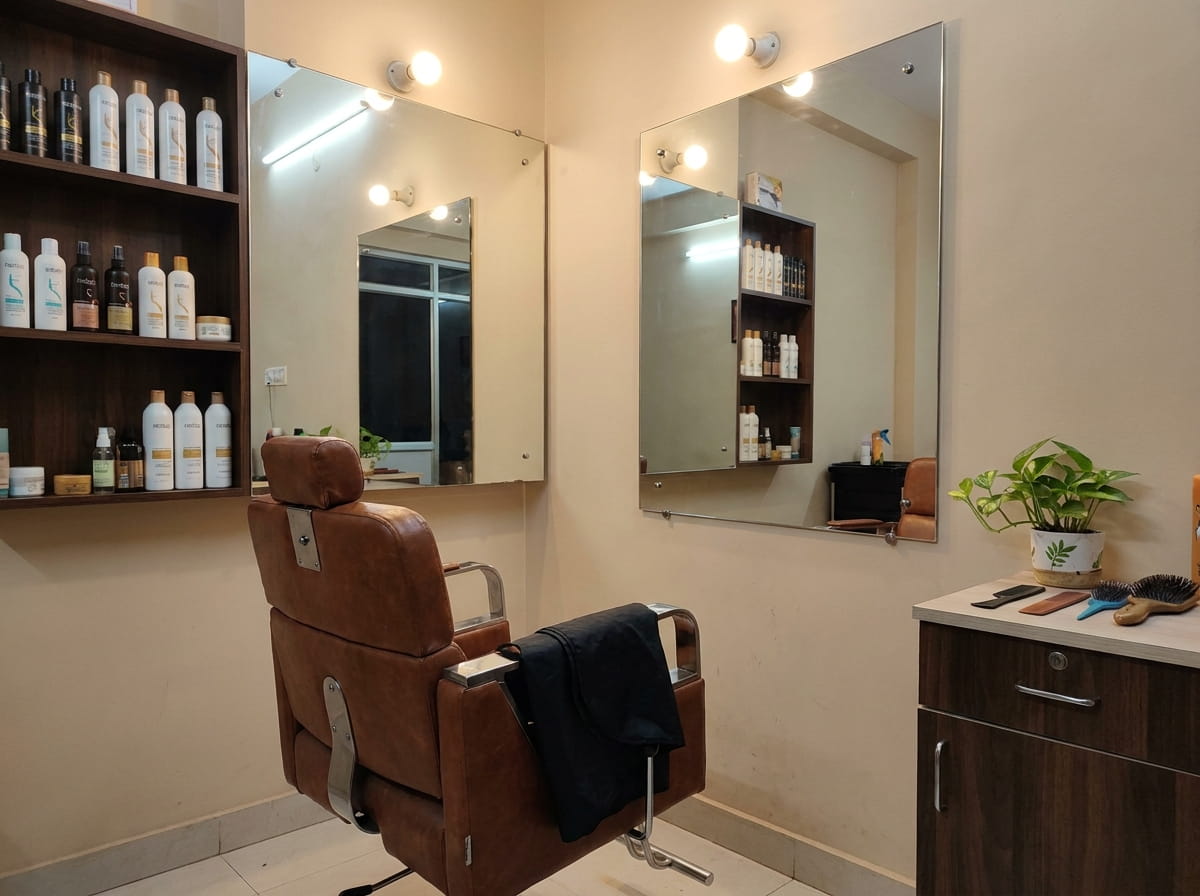 Barber cutting hair in a small salon